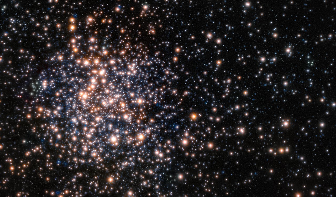 Peering through the thick dust clouds of the galactic bulge an international team of astronomers has revealed the unusual mix of stars in the stellar cluster known as Terzan 5. The new results indicate that Terzan 5 is in fact one of the bulge's primordial building blocks, most likely the relic of the very early days of the Milky Way. This picture is from the Multi-Conjugate Adaptive Optics Demonstrator (MAD), a prototype adaptive optics system used to demonstrate the feasibility of different techniques in the framework of the E-ELT and the second generation VLT Instruments. The star colours are from the Hubble image of the same star field.